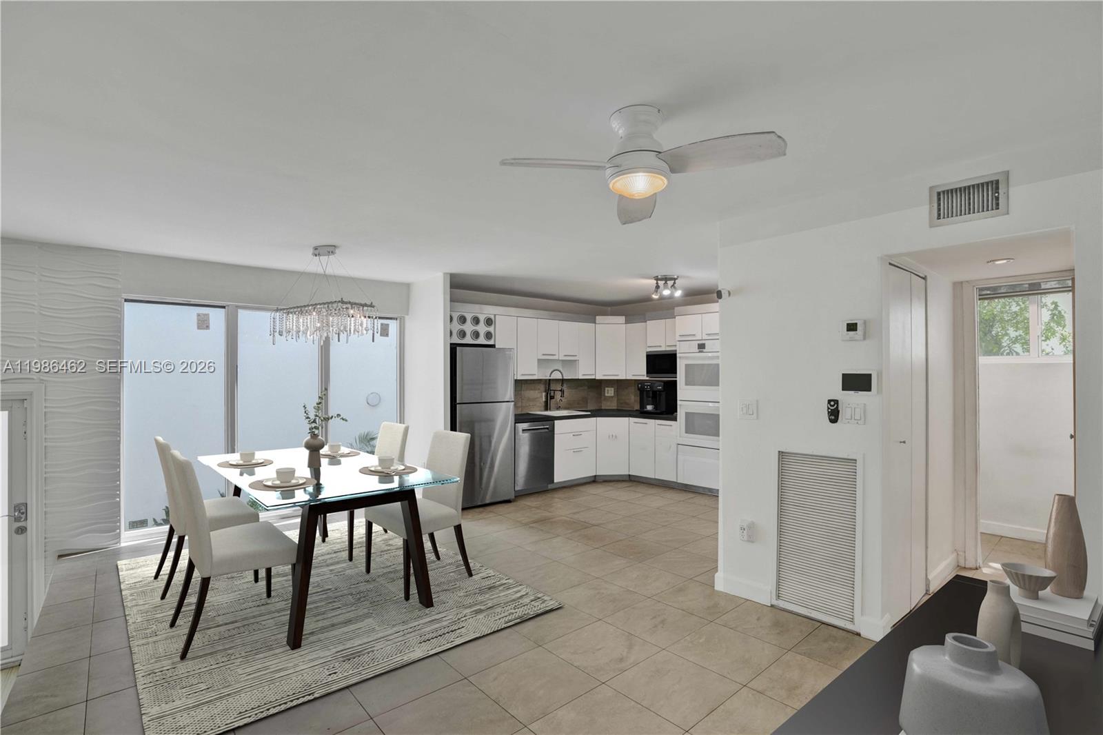 3126 Center Street, Unit 8 Coconut Grove, FL 33133 - Photo 9 of 50 a view of a dining room with furniture and wooden floor