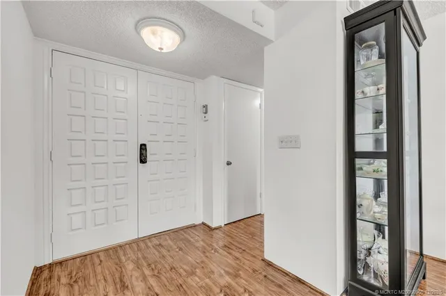 a kitchen with stainless steel appliances granite countertop a sink a stove and a microwave