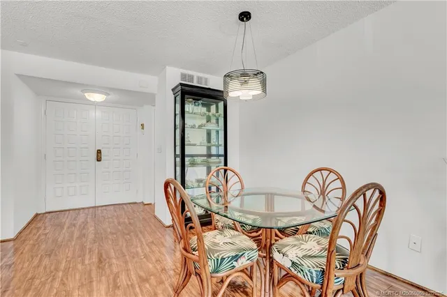 a kitchen with stainless steel appliances granite countertop a sink stove and microwave