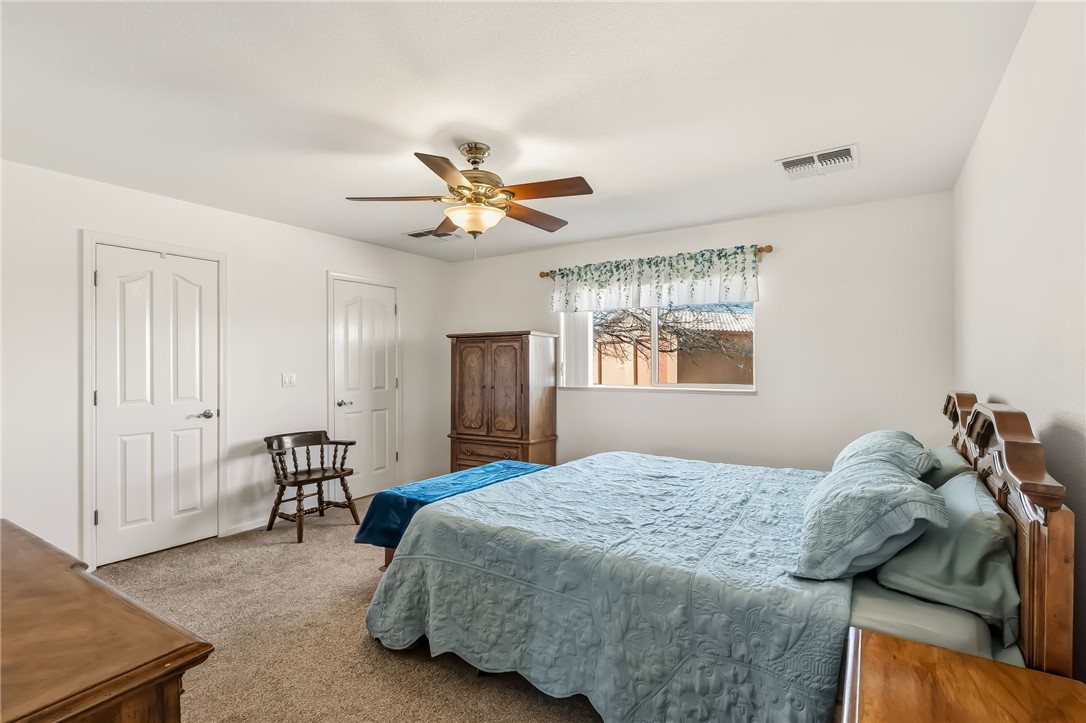 2205 East Cactus Wren Road Kingman, AZ 86409 - Photo 26 of 68 Primary Bedroom with His and Hers walk in closets
