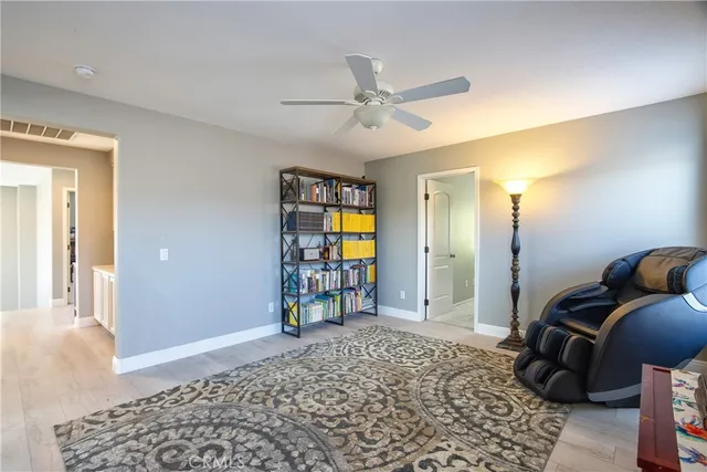 a view of a livingroom with workspace and a window