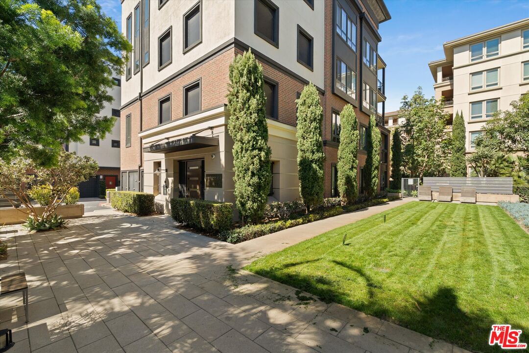 12883 West Runway Road, Unit 1 Playa Vista, CA 90094 - Photo 1 of 36 a view of a building with a yard