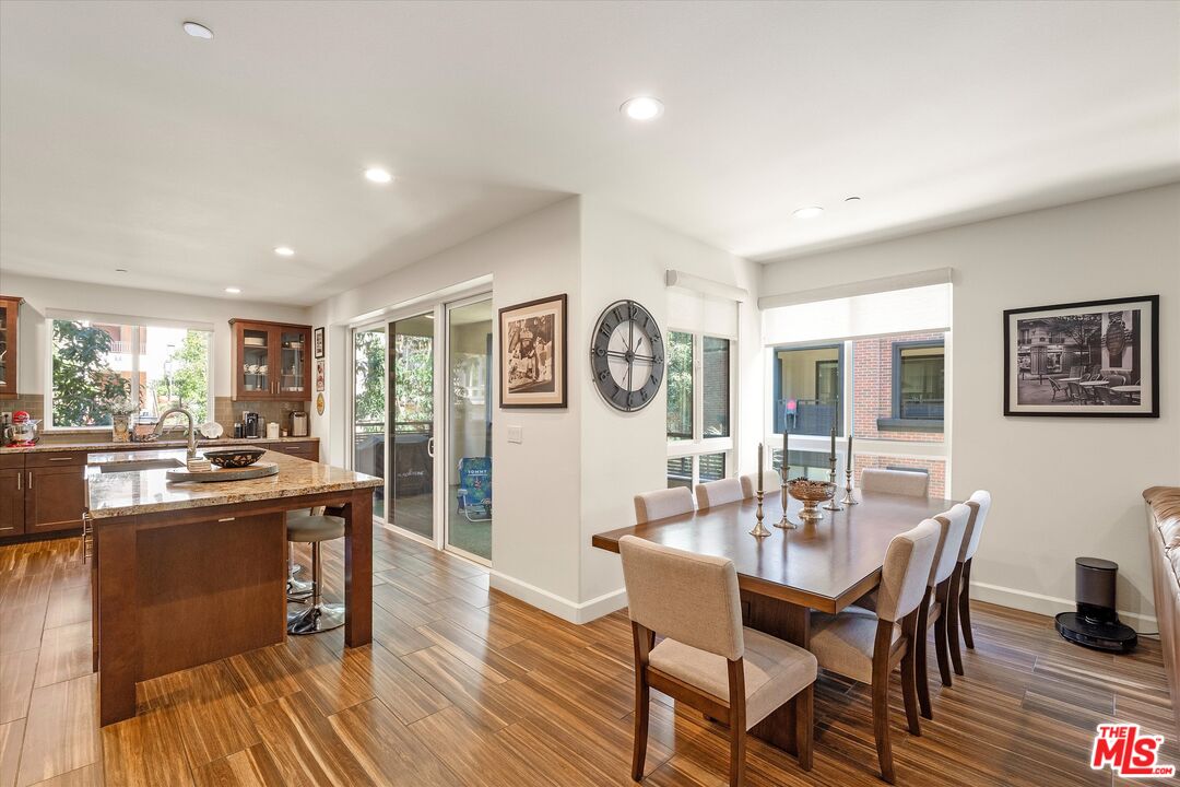12883 West Runway Road, Unit 1 Playa Vista, CA 90094 - Photo 13 of 36 a view of a dining room with furniture window and wooden floor