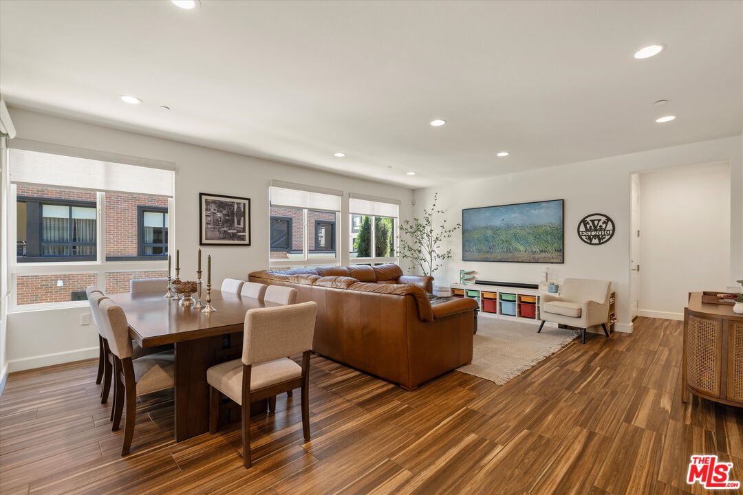 12883 West Runway Road, Unit 1 Playa Vista, CA 90094 - Photo 14 of 36 a living room with furniture and a flat screen tv