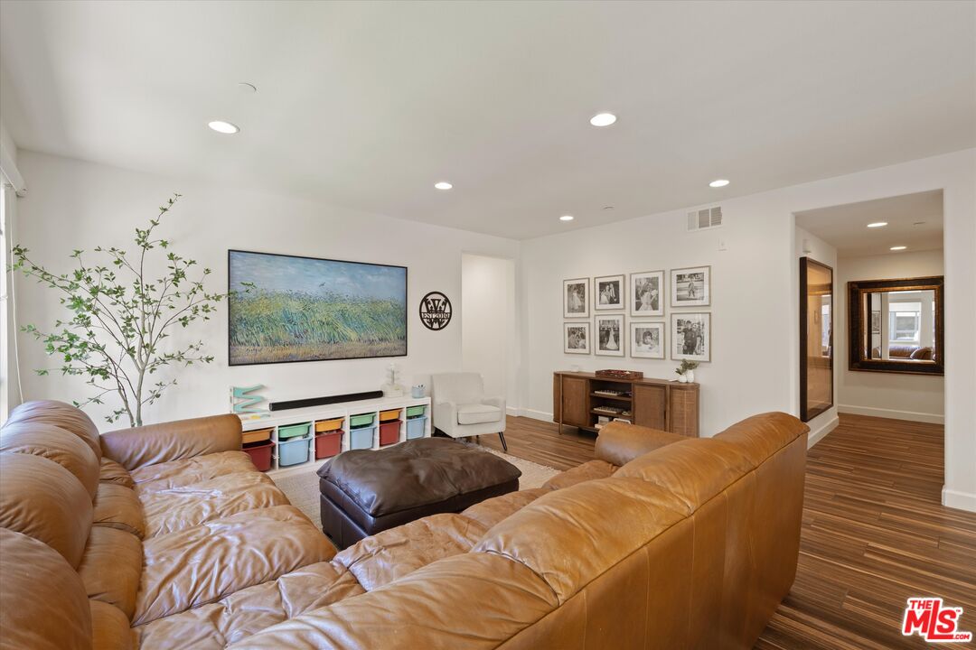 12883 West Runway Road, Unit 1 Playa Vista, CA 90094 - Photo 17 of 36 a living room with furniture and a flat screen tv