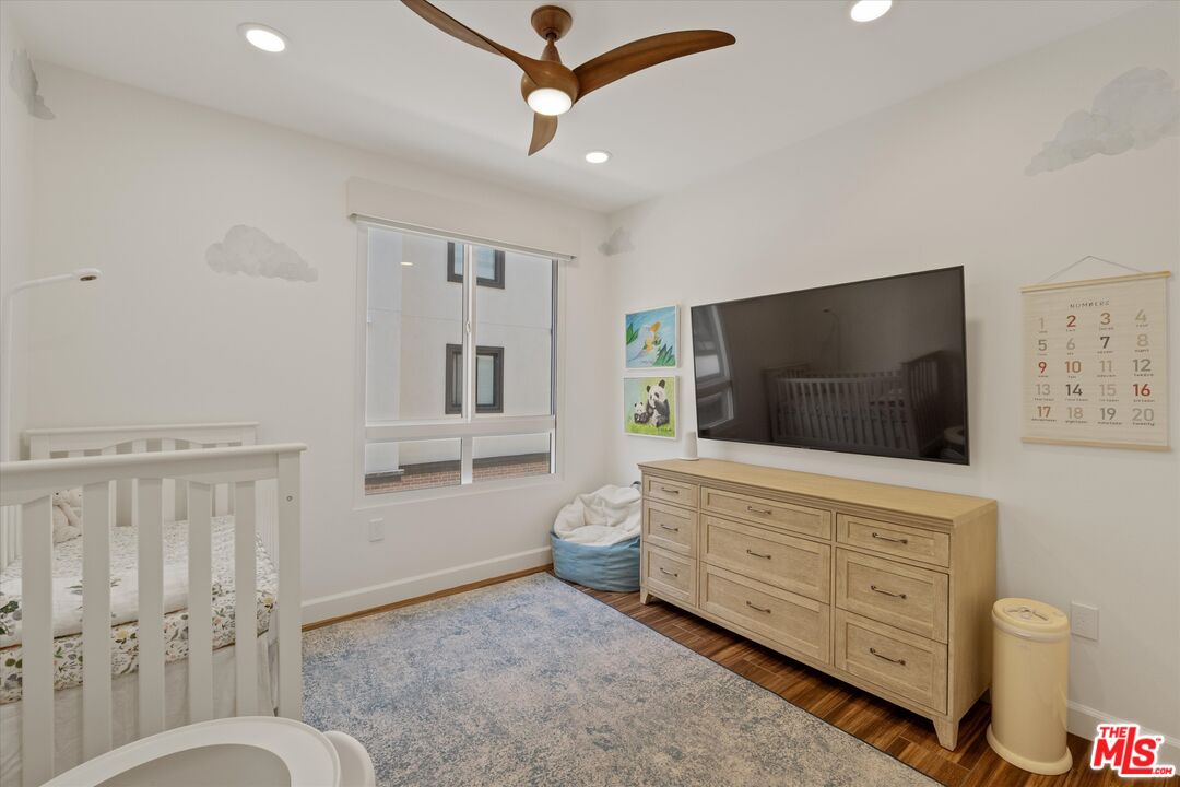 12883 West Runway Road, Unit 1 Playa Vista, CA 90094 - Photo 20 of 36 a living room with furniture and a flat screen tv