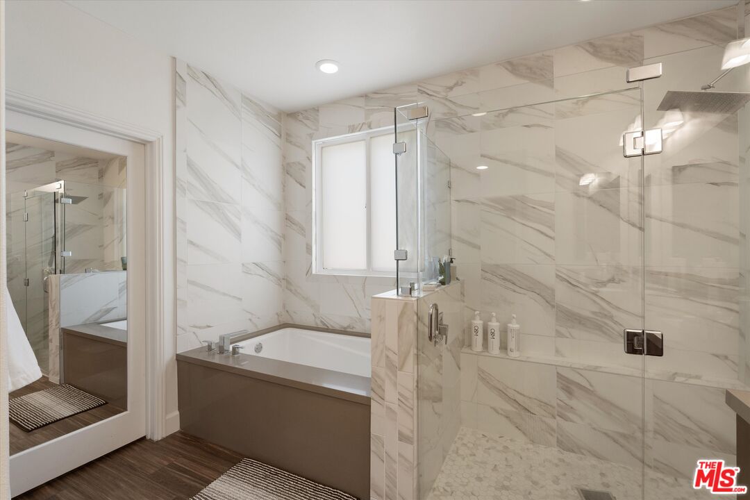 12883 West Runway Road, Unit 1 Playa Vista, CA 90094 - Photo 24 of 36 a bathroom with a tub a sink and mirror