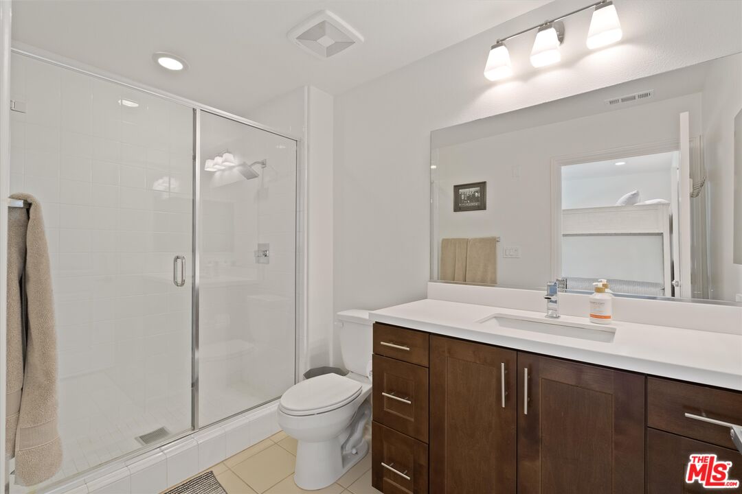 12883 West Runway Road, Unit 1 Playa Vista, CA 90094 - Photo 25 of 36 a bathroom with a sink a toilet and shower