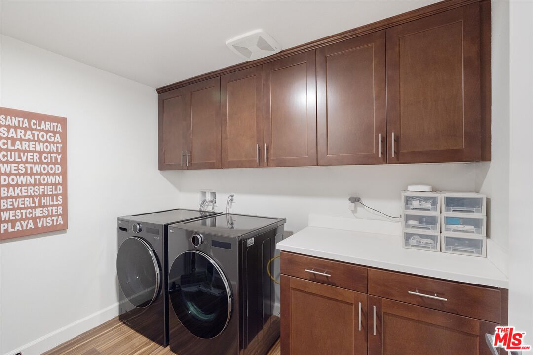 12883 West Runway Road, Unit 1 Playa Vista, CA 90094 - Photo 27 of 36 a view of a storage and utility room with washer and dryer