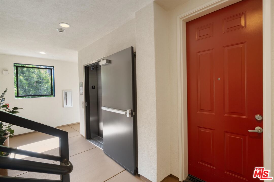 12883 West Runway Road, Unit 1 Playa Vista, CA 90094 - Photo 5 of 36 a view of an entryway with wooden floor