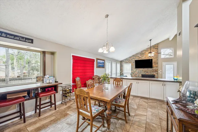 a view of a dining room with furniture window and outside view