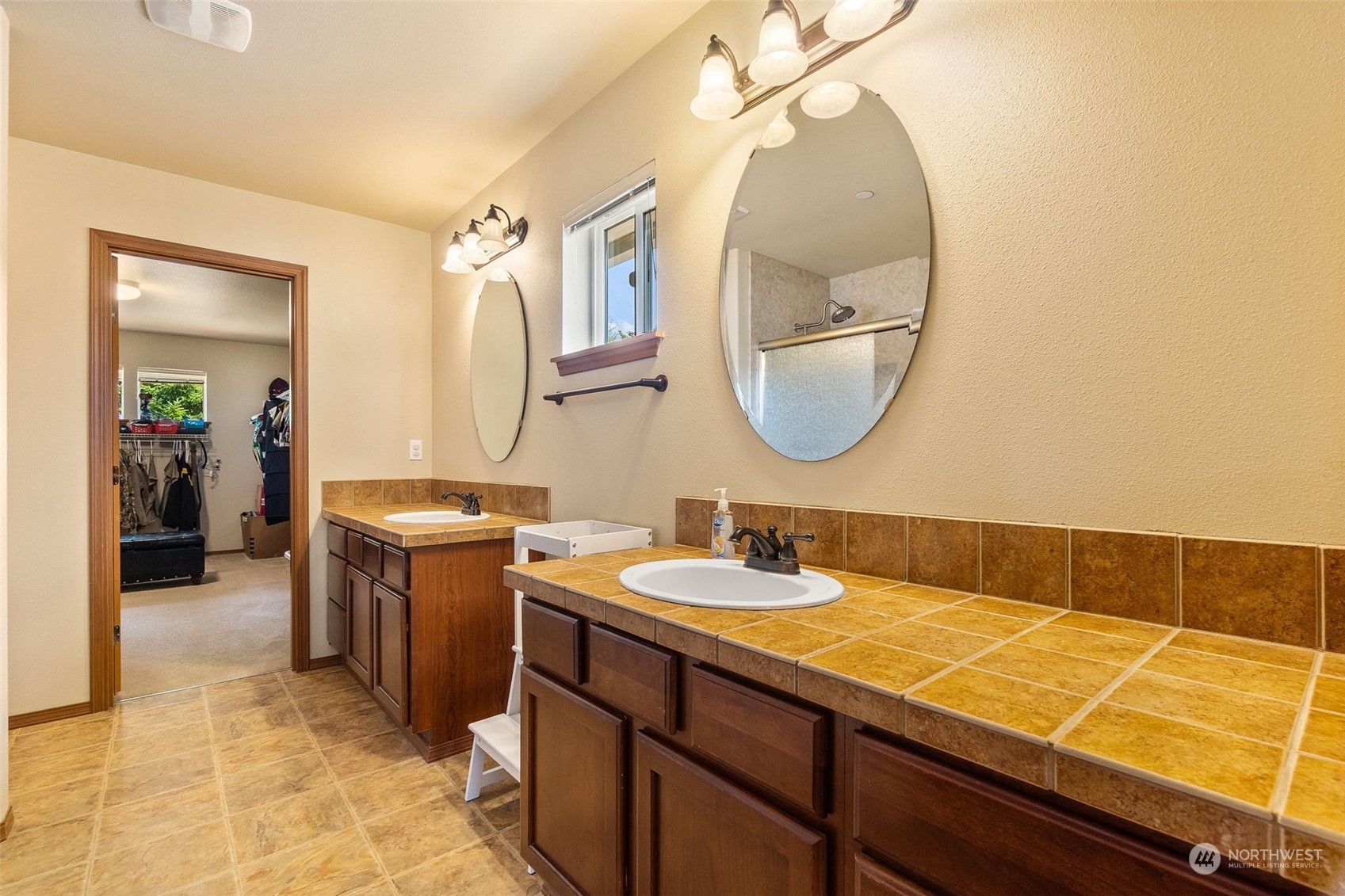 1340 Foreman Road DuPont, WA 98327 - Photo 18 of 37 a bathroom with a sink and a mirror