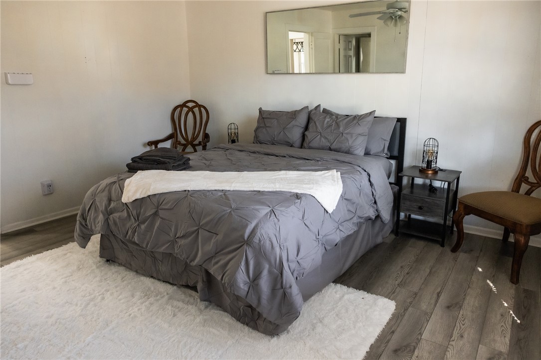 1308 Antone Street Bryan, TX 77803 - Photo 21 of 36 a bedroom with a bed a table and chair