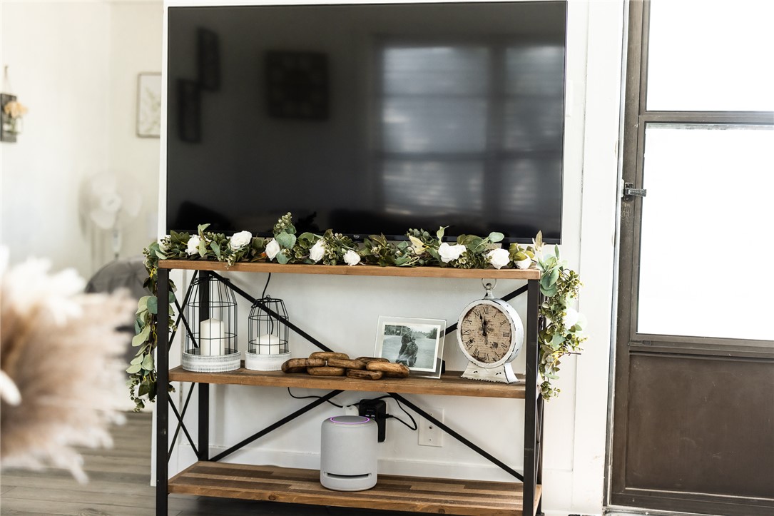 1308 Antone Street Bryan, TX 77803 - Photo 3 of 36 a table with white walls and painting on a wall