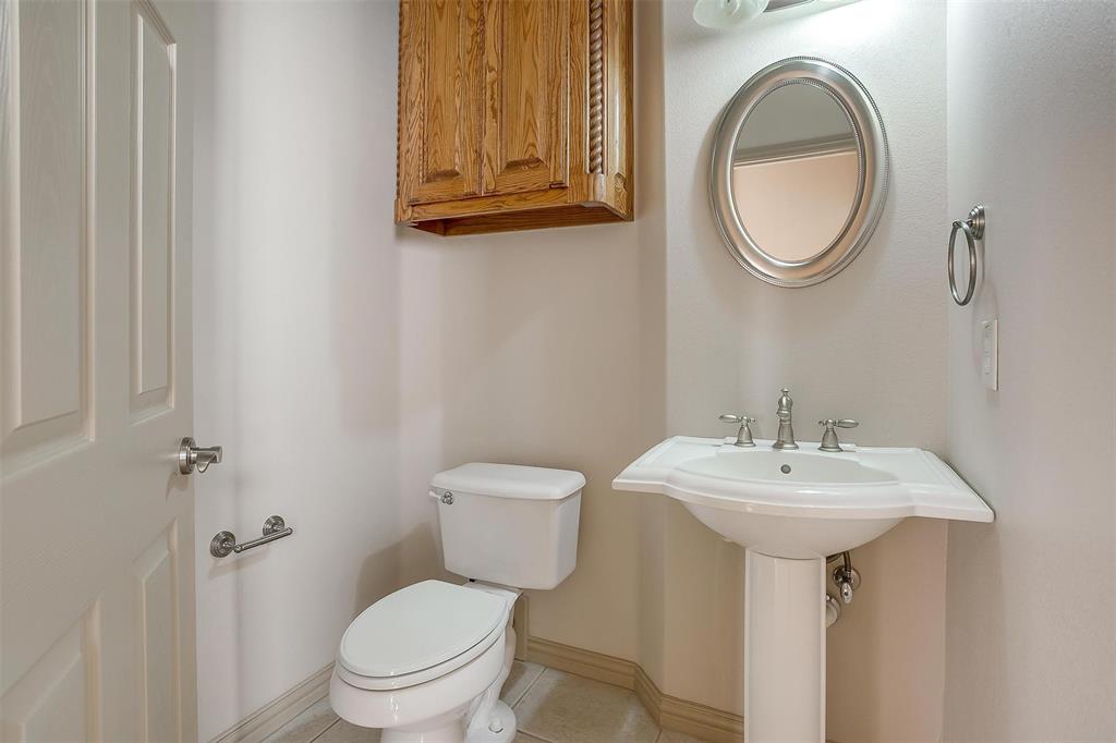 13780 Riviera West Fort Worth, TX 76028 - Photo 29 of 39 half bath off the living room/dining/kitchen