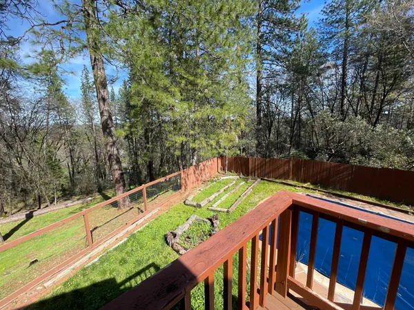 a view of a two chairs on the roof deck