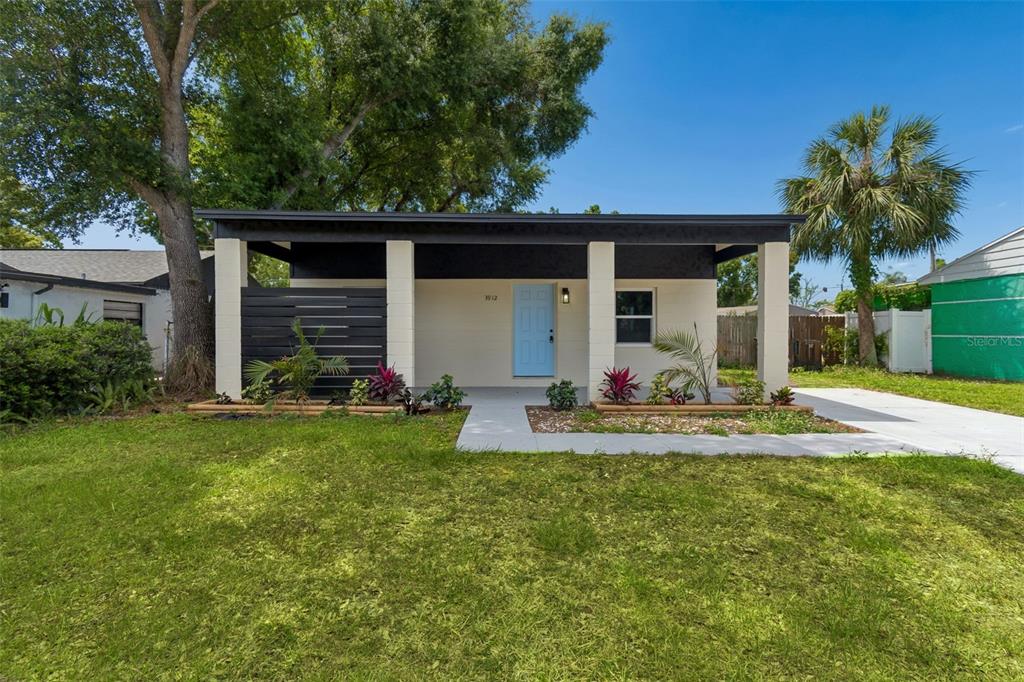 3912 West Pine Street Tampa, FL 33607 - Photo 3 of 60 a view of a house with backyard and porch