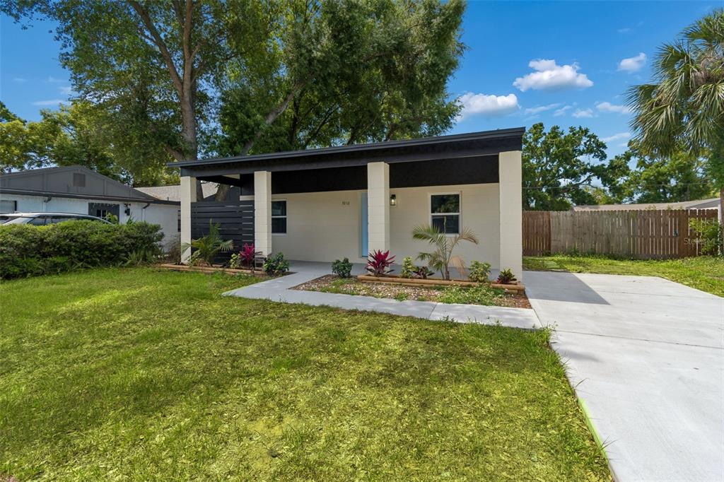 3912 West Pine Street Tampa, FL 33607 - Photo 4 of 60 a view of a house with backyard and sitting area