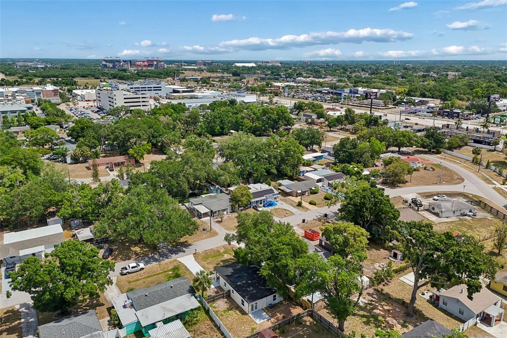 3912 West Pine Street Tampa, FL 33607 - Photo 58 of 60 an aerial view of a city with lots of residential buildings ocean and mountain view in back