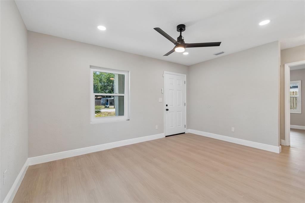 3912 West Pine Street Tampa, FL 33607 - Photo 10 of 60 a view of an empty room with a window