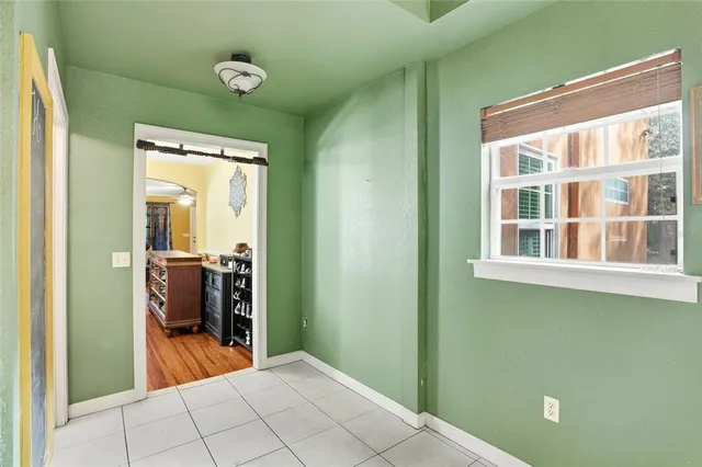 a view of a hallway with a bathroom