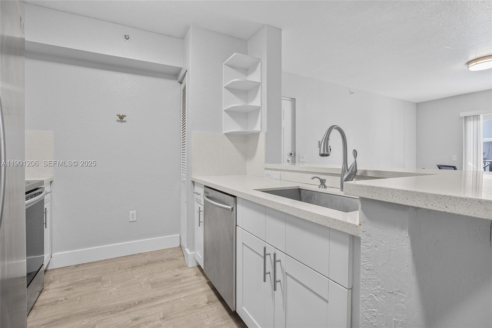 15410 Southwest 284th Street, Unit 8208 Homestead, FL 33033 - Photo 9 of 20 a kitchen with a sink and cabinets