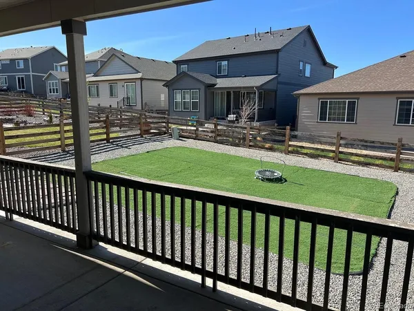 a view of a house with pool and chairs