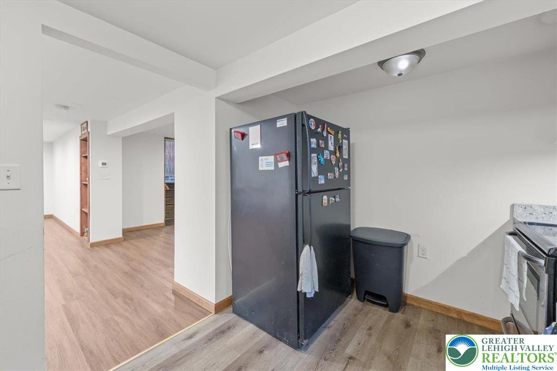 217 Coach Road Tobyhanna, PA 18466 - Photo 11 of 35 a view of a hallway with wooden floor and cabinet