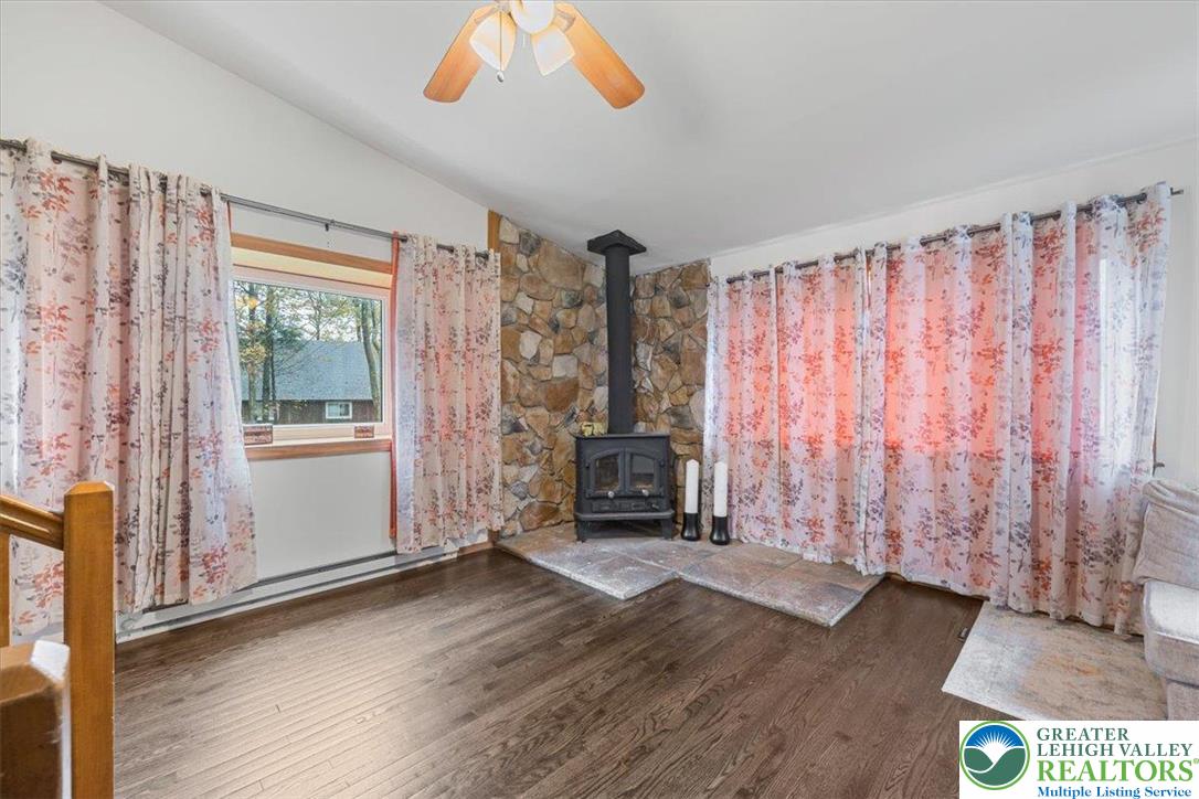 217 Coach Road Tobyhanna, PA 18466 - Photo 13 of 35 a view of an empty room with wooden floor and a window