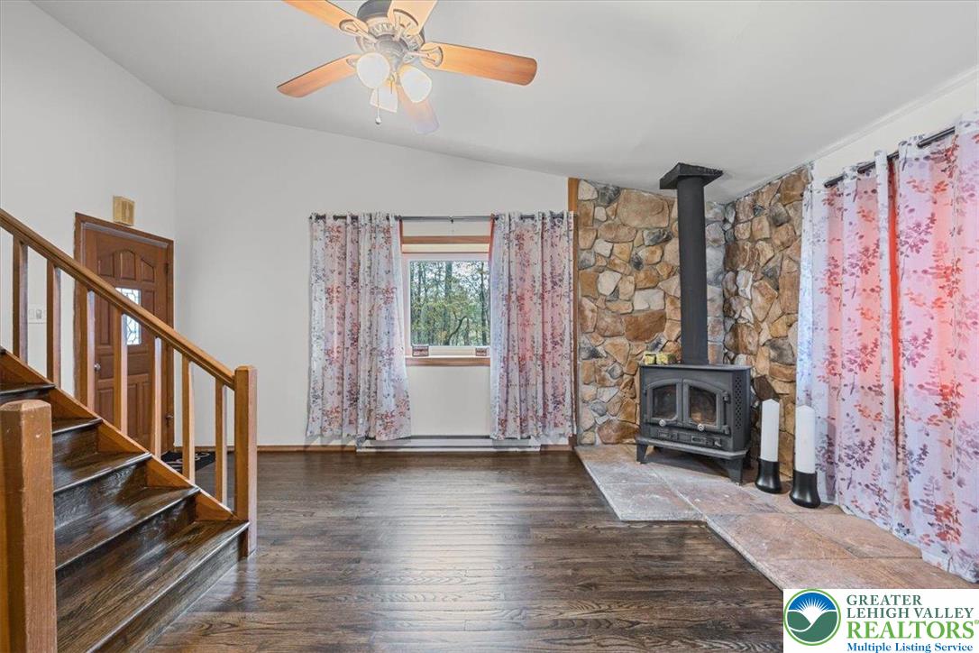 217 Coach Road Tobyhanna, PA 18466 - Photo 14 of 35 a view of livingroom with furniture fireplace and window