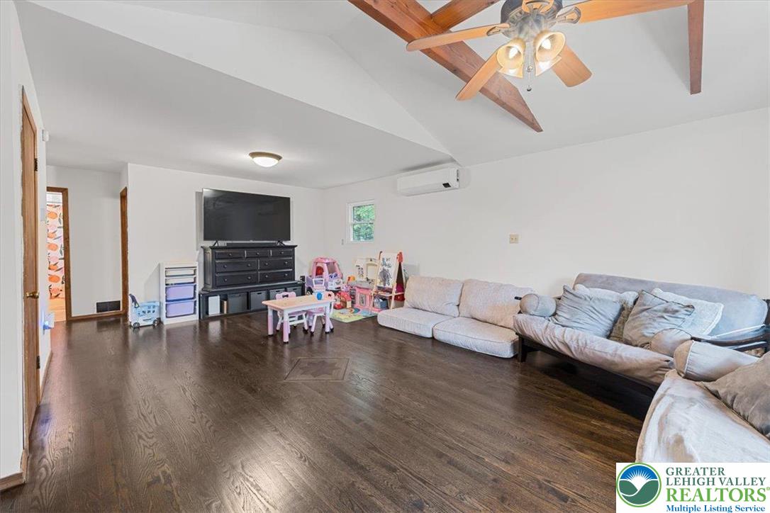 217 Coach Road Tobyhanna, PA 18466 - Photo 17 of 35 a living room with furniture and a flat screen tv