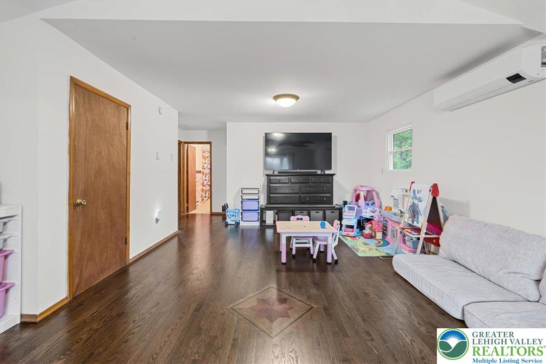 217 Coach Road Tobyhanna, PA 18466 - Photo 18 of 35 a living room with furniture and a flat screen tv