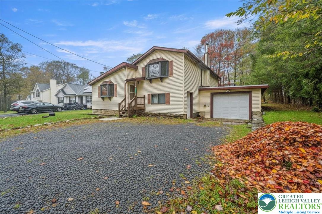 217 Coach Road Tobyhanna, PA 18466 - Photo 2 of 35 a front view of a house with a yard