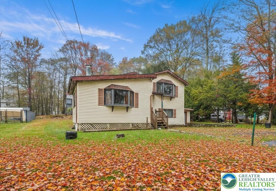 217 Coach Road Tobyhanna, PA 18466 - Photo 3 of 35 a front view of a house with garden