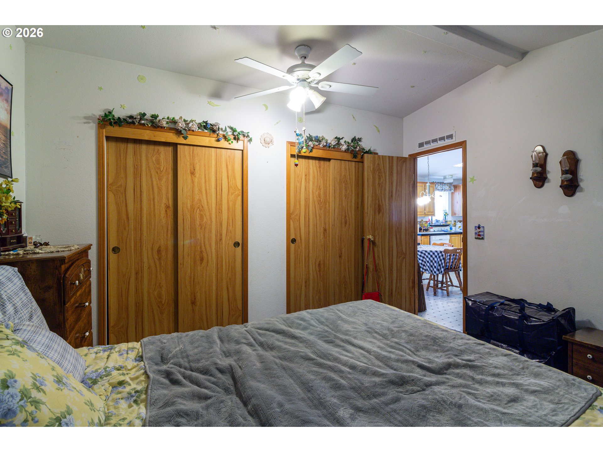 1375 Southwest 15th Street Hermiston, OR 97838 - Photo 11 of 14 a bedroom with a bed and a chandelier