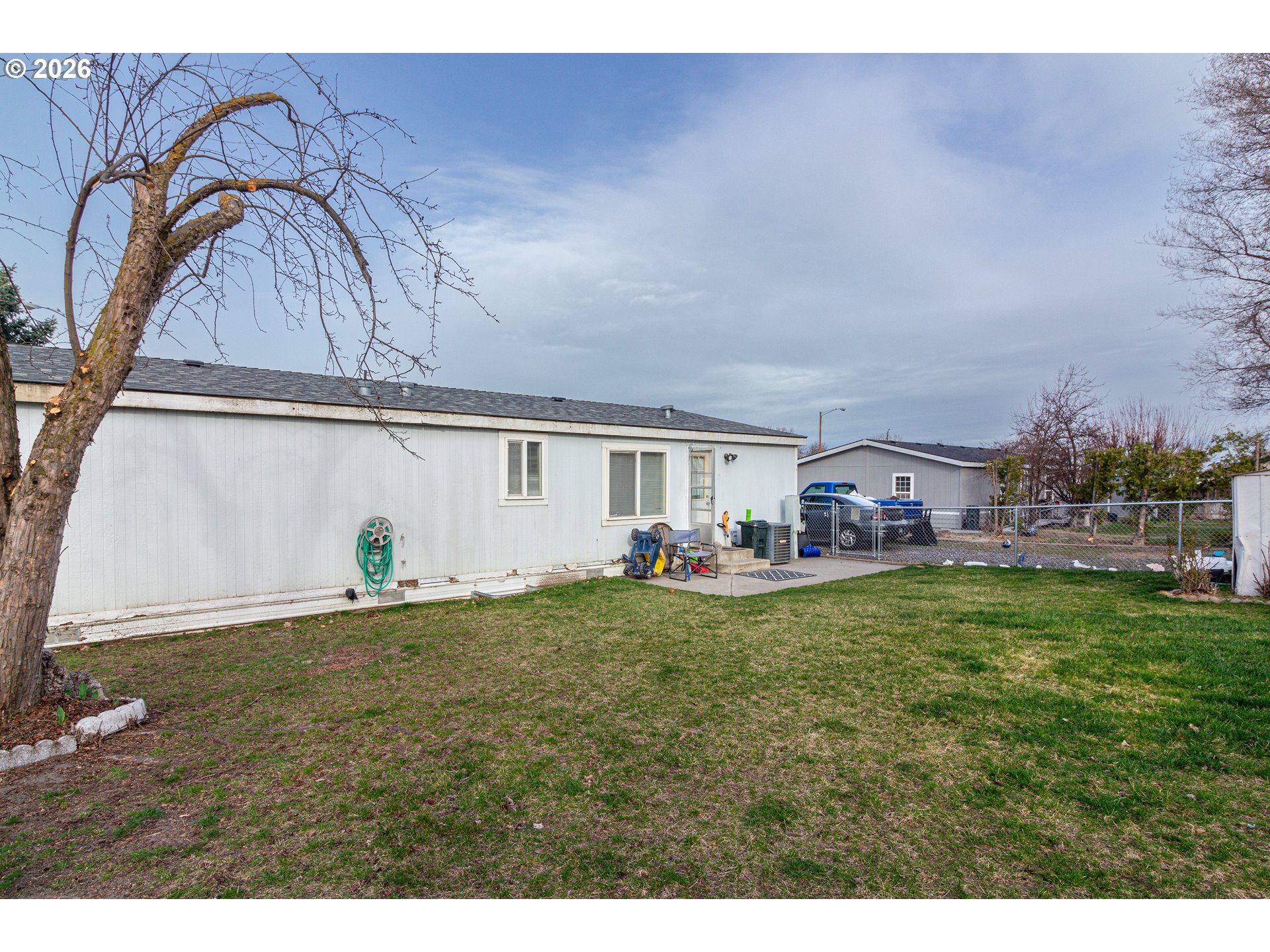 1375 Southwest 15th Street Hermiston, OR 97838 - Photo 4 of 14 a backyard of a house with table and chairs
