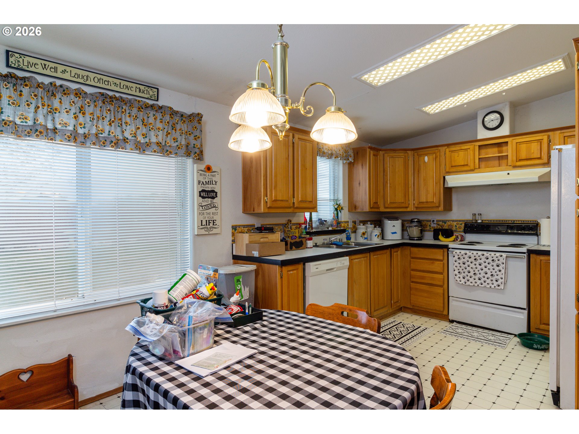 1375 Southwest 15th Street Hermiston, OR 97838 - Photo 7 of 14 a kitchen with stainless steel appliances kitchen island granite countertop a stove a sink and a granite counter tops