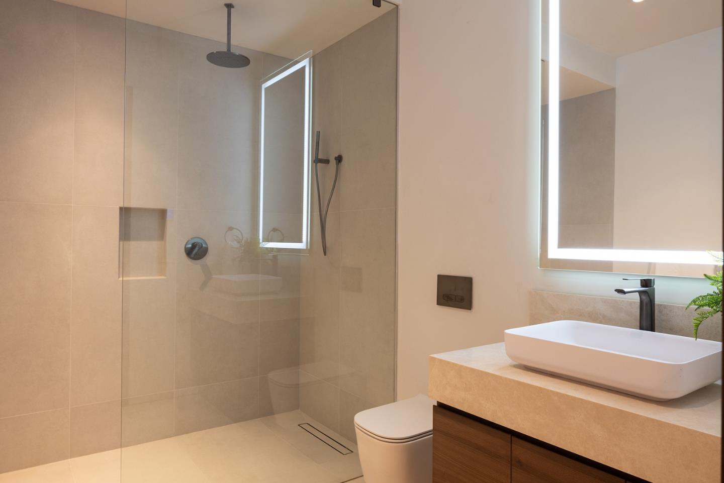 31 Poppy Lane Pebble Beach, CA 93953 - Photo 36 of 45 a bathroom with a sink toilet vanity and shower