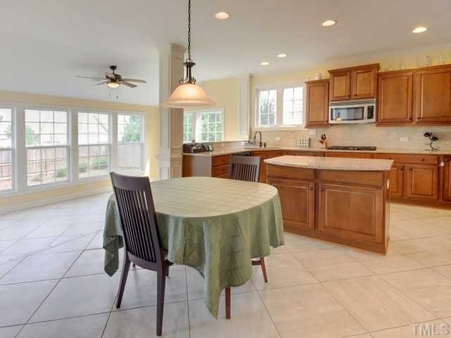 2412 Treen Street Raleigh, NC 27614 - Photo 7 of 25 Eat in kitchen open to bright and sunny sunroom
