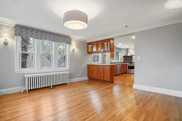 a view of kitchen with furniture and wooden floor