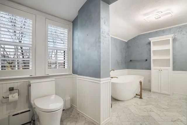 a bathroom with a toilet sink and a bathtub