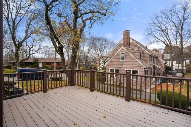 a view of a wooden deck and a yard