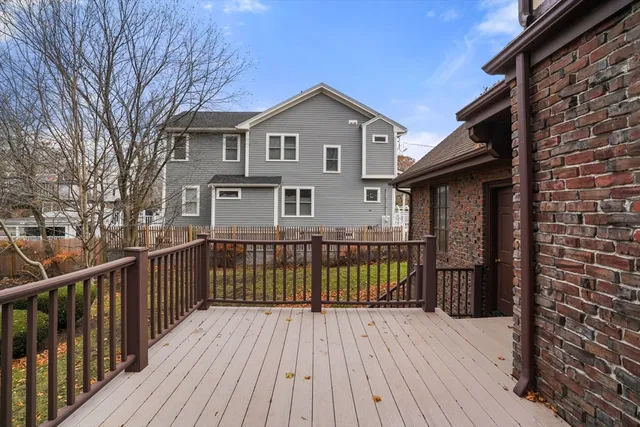 a view of a house with a wooden deck
