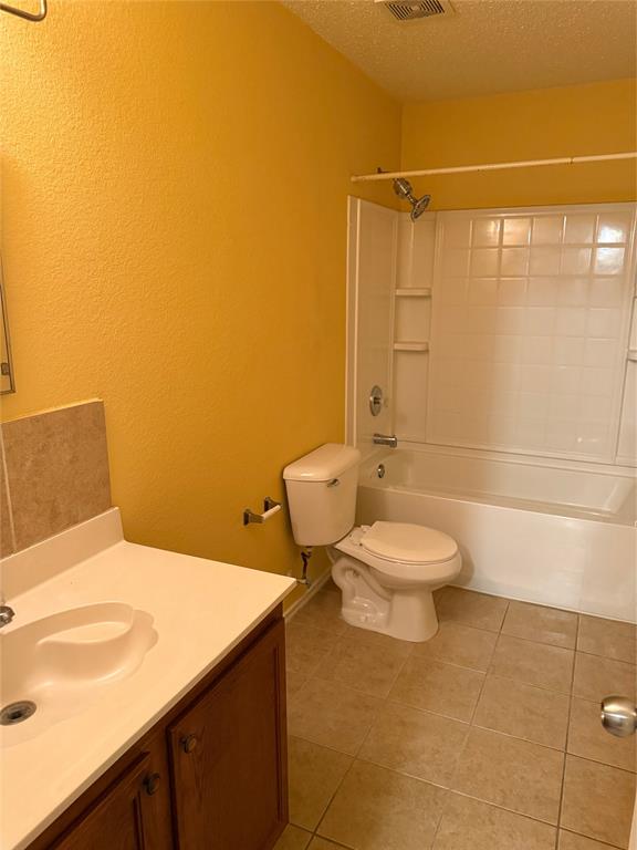 2011 Cap Rock Lane Grand Prairie, TX 75052 - Photo 7 of 9 a bathroom with a toilet and a shower