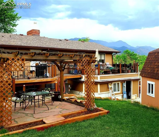 a view of a swimming pool and lounge chairs