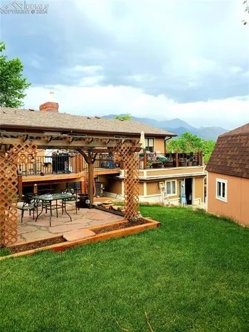 a view of yard from deck having patio