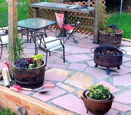 a kitchen with stainless steel appliances granite countertop a refrigerator and cabinets
