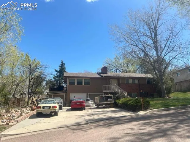 a view of a parked cars in front of house