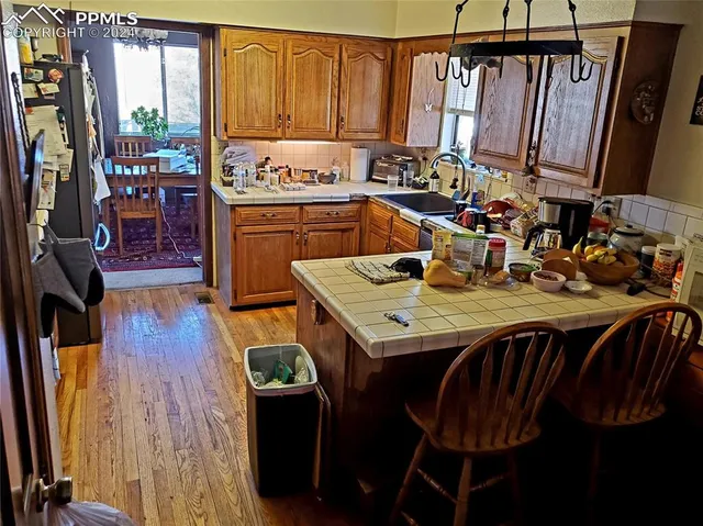 a dining room with furniture and a window