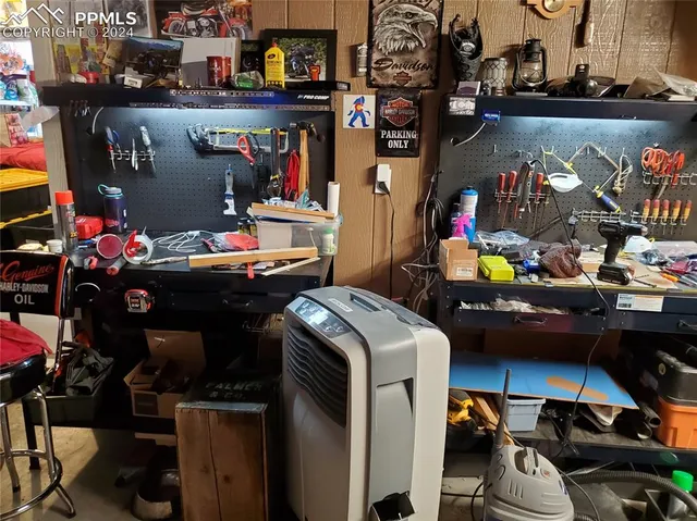 a room with fireplace and television